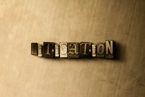 Tan background with typeset letter blocks that form the word, "Litigation"